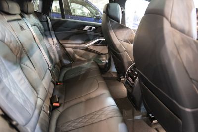 Luxury rear leather seats with detailed stitching and spacious design