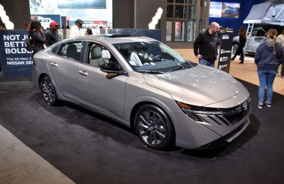 Sleek front fascia and aerodynamic side profile of a modern sedan