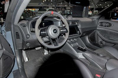 Sporty steering wheel and digital dashboard with modern infotainment