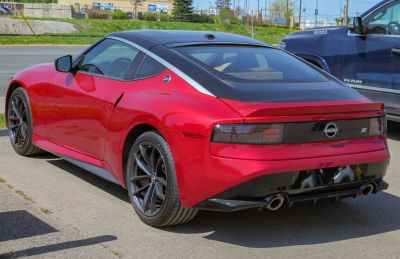 Sporty rear and side view with sleek taillights and dual exhausts