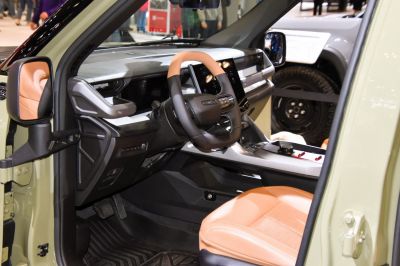 Modern dashboard with touchscreen and tan leather seats