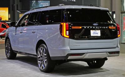 Full-size SUV rear with sleek LED taillights and black trim panel