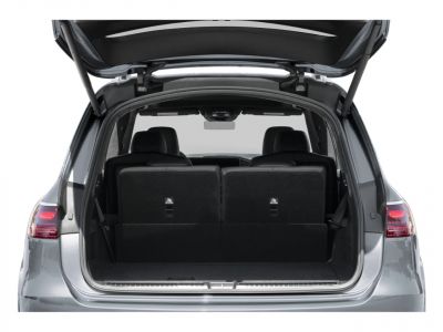 SUV rear cargo area with upright seats and open tailgate