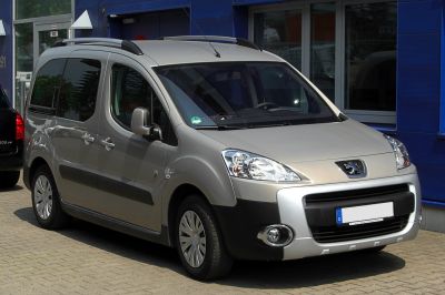 Compact MPV front view with roof rails and distinct headlights