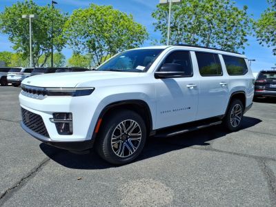 White SUV with modern grille, LED headlights, multi-spoke wheels