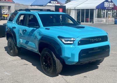 Rugged SUV with aggressive grille and off-road tires