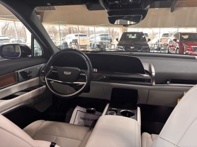 Modern digital dashboard and steering wheel inside luxury SUV