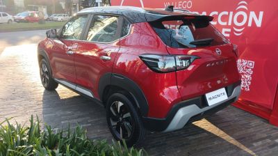 Rear and side view of red SUV with black roof contrast and updated taillights