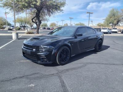 Aggressive front fascia and sporty side profile in black.