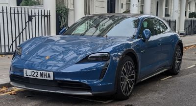Front view of blue electric vehicle with LED headlights