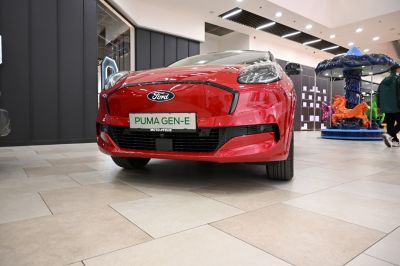 Front view of a compact electric hatchback with sleek bumper and LED headlights