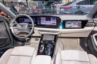 Dual digital screens and modern dashboard with steering wheel controls
