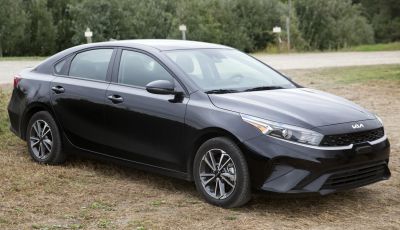 Front side view with sleek headlights and alloy wheels