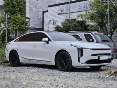 Sleek white sedan with aerodynamic shape and black alloy wheels