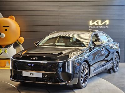 Gloss black sedan front with vertical LED headlights and aerodynamic design