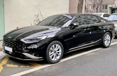 Luxury sedan with diamond grille and LED headlights front side view