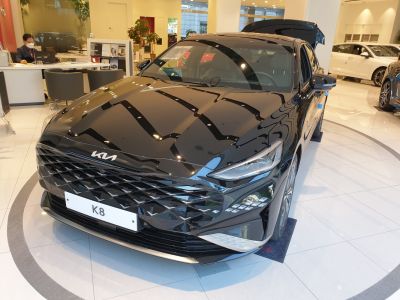 Sharp front grille and distinctive LED headlights on sleek sedan