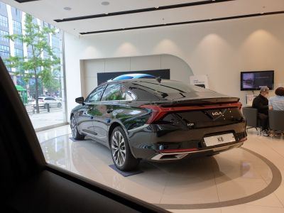 Rear view of sleek sedan with LED tail lights and alloy wheels