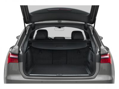 Spacious rear cargo area with open hatch and retractable cover