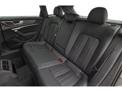 Black leather rear seats with detailed stitching and modern door panel
