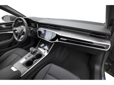 Modern interior dashboard and center console with digital displays and wood grain trim