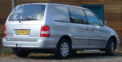 Minivan rear view with sliding doors and large windows