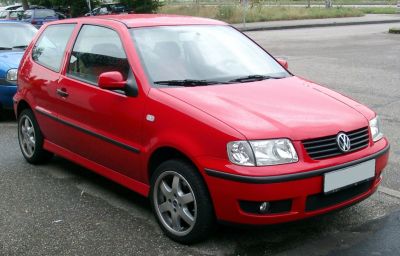 Red hatchback with alloy wheels, front three-quarter angle view