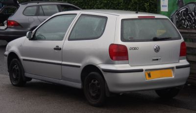 Silver 3-door hatchback rear view with red tail lights and steel wheels