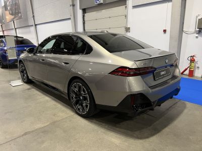 Rear and side view of sedan with LED taillights and alloy wheels