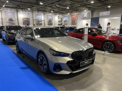 Front view of 2024 BMW 5 Series sedan with black kidney grille