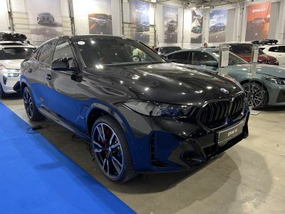 Black sporty SUV with prominent kidney grille and alloy wheels