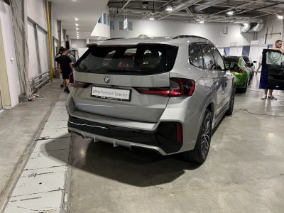 Rear view of a modern SUV with sleek tail lights and sporty design