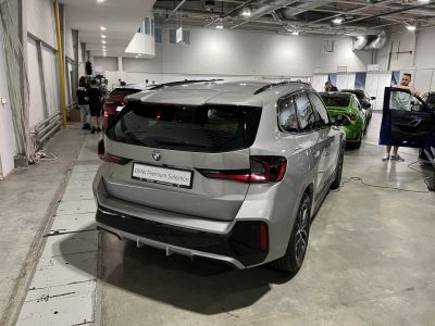 Rear view showing modern taillights and sporty bumper design of a compact SUV.