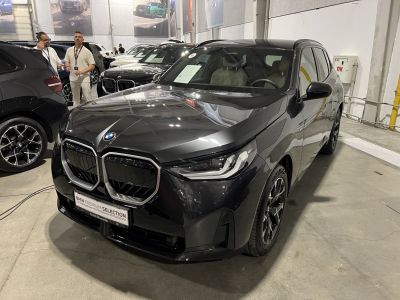 Front view of black SUV with BMW kidney grille and LED headlights
