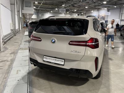 Rear view of white SUV with LED taillights and modern rear window design