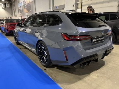 Sleek rear design with modern taillights and quad exhausts.