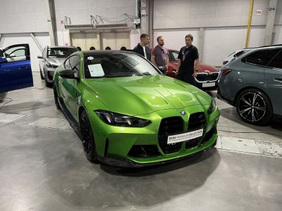 Bright green sports coupe with aggressive front grille and aerodynamic styling
