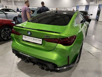 Rear view of sporty coupe with quad exhausts and sleek taillights