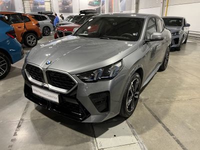 Large kidney grille and sharp LED headlights on sleek gray SUV