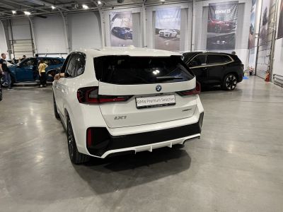 Rear view of white SUV with LED taillights and sporty bumper