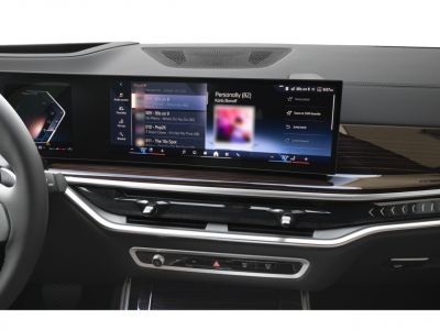 Wide digital dashboard with touchscreen infotainment and climate controls
