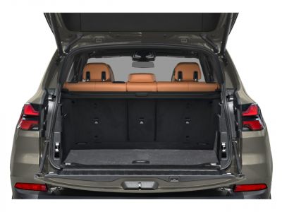 Open trunk with spacious cargo area and visible tan leather rear seats
