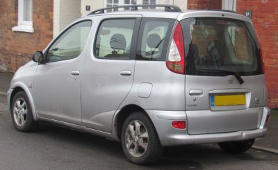 Rear side profile with distinctive taillights and compact minivan shape