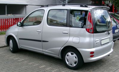 Compact MPV rear side with rounded design and rear spoiler
