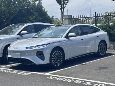 Sleek aerodynamic electric sedan with LED headlights and multi-spoke wheels