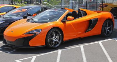 Convertible sports car with aerodynamic design and racing wheels