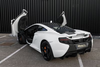 Supercar with scissor doors and aerodynamic rear design