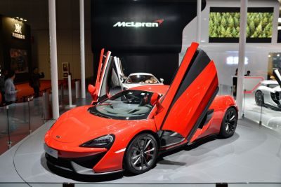 Red sports car with distinctive butterfly doors