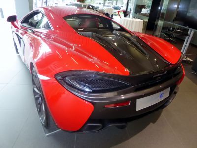 Rear view with black engine cover and distinctive taillights