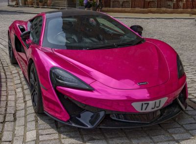 Front view of a sleek sports car with aerodynamic design.